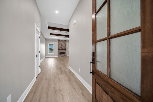 122 Buffalo Ridge Rd, Giddings, TX 78942 - hall featuring beamed ceiling, light wood-type flooring, and recessed lighting