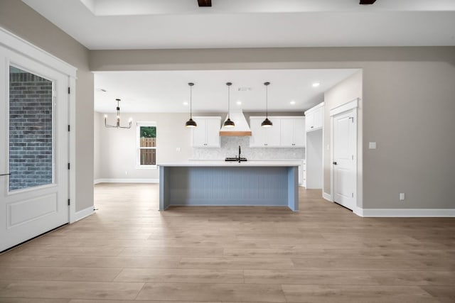 122 Buffalo Ridge Rd, Giddings, TX 78942 - kitchen with white cabinetry, a chandelier, decorative backsplash, light countertops, and recessed lighting