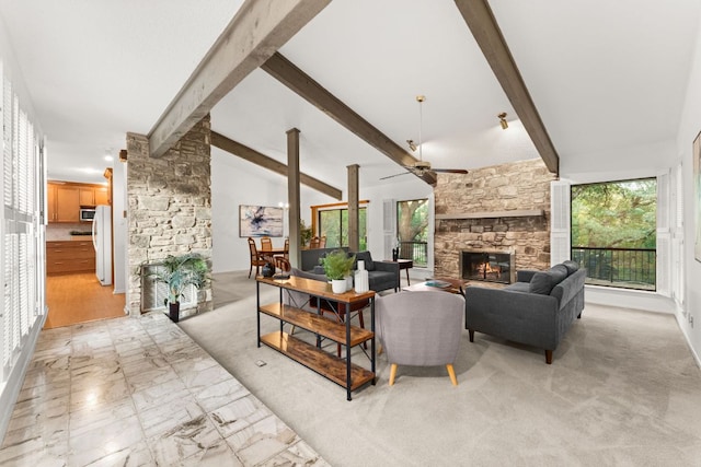 605 Flamingo Blvd, Lakeway, TX 78734 - living area featuring a stone fireplace and a ceiling fan