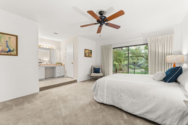 605 Flamingo Blvd, Lakeway, TX 78734 - carpeted bedroom featuring access to exterior, a ceiling fan, a desk, and ensuite bathroom