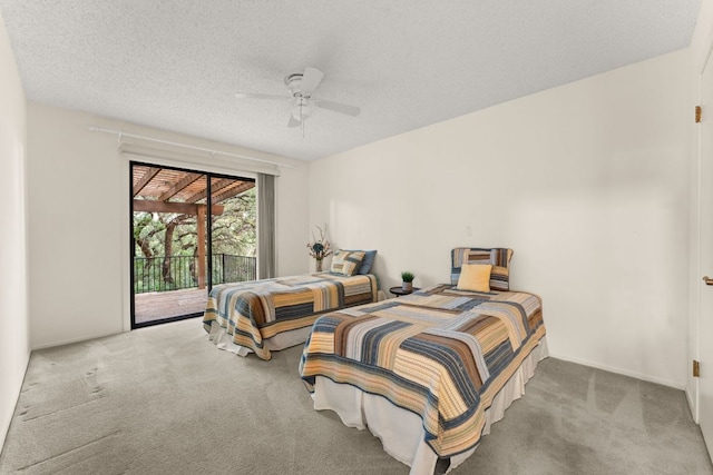 605 Flamingo Blvd, Lakeway, TX 78734 - bedroom with access to exterior, carpet flooring, a ceiling fan, and a textured ceiling
