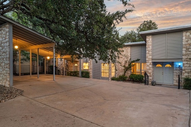 605 Flamingo Blvd, Lakeway, TX 78734 - view of front of home featuring stone siding and concrete driveway