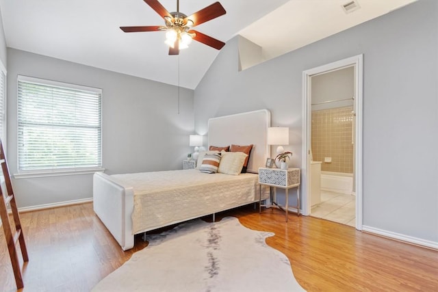 2207 Shoalmont Dr, Austin, TX 78756 - bedroom featuring lofted ceiling, wood finished floors, connected bathroom, and ceiling fan
