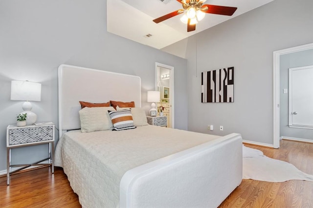 2207 Shoalmont Dr, Austin, TX 78756 - bedroom featuring wood finished floors, vaulted ceiling, and a ceiling fan