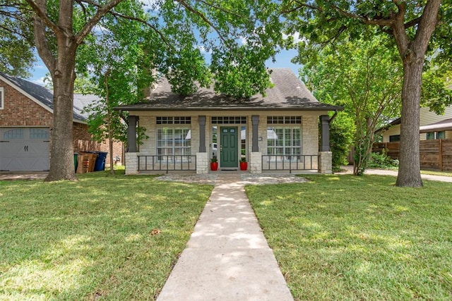 2207 Shoalmont Dr, Austin, TX 78756 - view of front of property featuring covered porch, stone siding, and a garage
