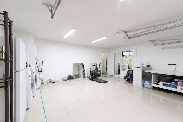 1106 Saucedo St, Austin, TX 78721 - garage with freestanding refrigerator and washer and dryer