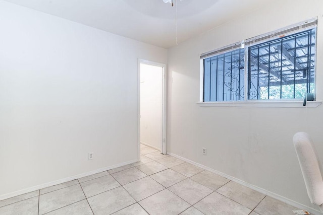 1106 Saucedo St, Austin, TX 78721 - spare room with baseboards and tile patterned floors