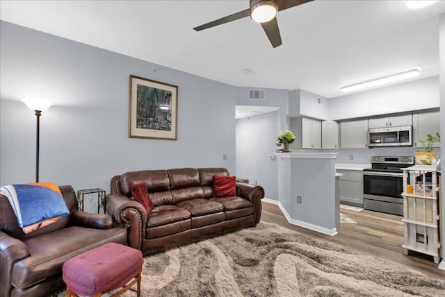 2320 Gracy Farms Ln Unit 918, Austin, TX 78758 - living area with light wood-type flooring and a ceiling fan