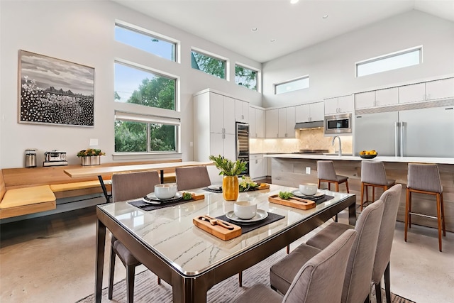 2004 Pennsylvania Ave Unit A, Austin, TX 78702 - dining space with a high ceiling, finished concrete flooring, plenty of natural light, and recessed lighting