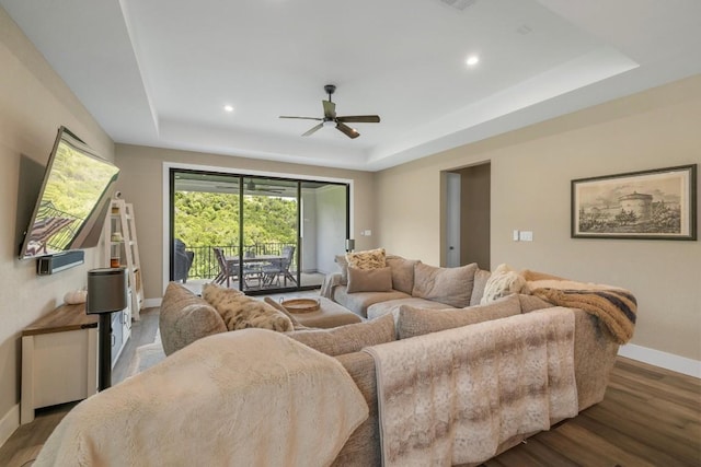 1332 Brescia Walk, Leander, TX 78641 - living area featuring a tray ceiling, wood finished floors, ceiling fan, and recessed lighting