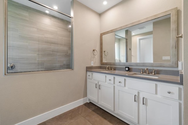 1332 Brescia Walk, Leander, TX 78641 - bathroom with double vanity, tile patterned floors, and recessed lighting