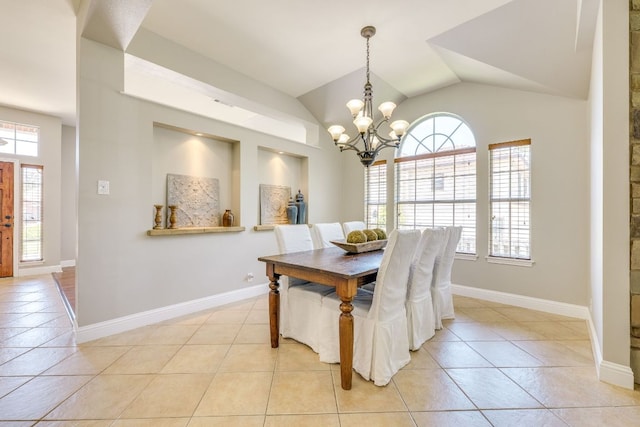 604 Cutty Trl, Lakeway, TX 78734 - dining area with a chandelier, light tile patterned floors, and lofted ceiling
