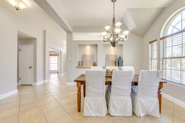 604 Cutty Trl, Lakeway, TX 78734 - dining room featuring a chandelier, healthy amount of natural light, and light tile patterned floors