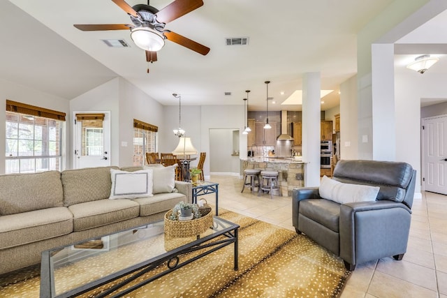 604 Cutty Trl, Lakeway, TX 78734 - living area featuring light tile patterned floors, ceiling fan, a chandelier, and lofted ceiling