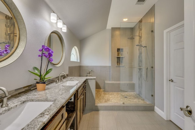 604 Cutty Trl, Lakeway, TX 78734 - full bath featuring a walk in shower, double vanity, and vaulted ceiling