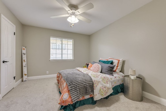 604 Cutty Trl, Lakeway, TX 78734 - carpeted bedroom with baseboards and ceiling fan