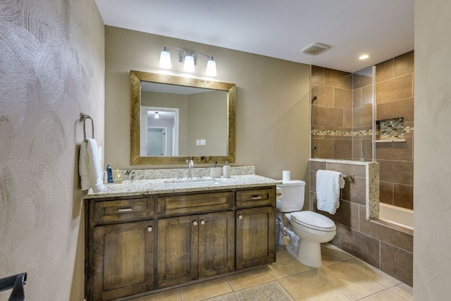 604 Cutty Trl, Lakeway, TX 78734 - bathroom featuring tile patterned floors, vanity, tiled shower / bath combo, and a textured wall