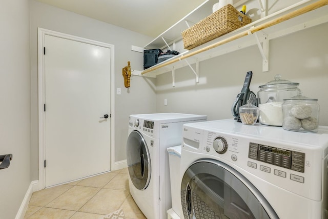 604 Cutty Trl, Lakeway, TX 78734 - laundry room featuring independent washer and dryer and light tile patterned floors