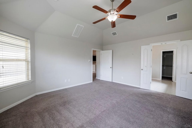 21016 Abigail Way, Pflugerville, TX 78660 - unfurnished bedroom with carpet flooring, lofted ceiling, a spacious closet, and a ceiling fan