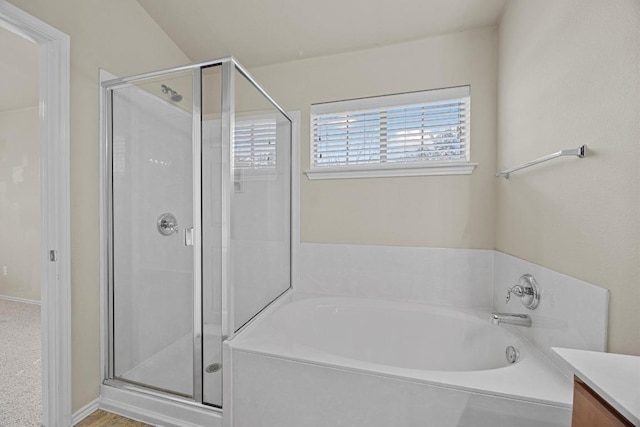 1310 Parmer Ln W Unit 3201, Austin, TX 78727 - bathroom featuring a stall shower, a garden tub, and vanity