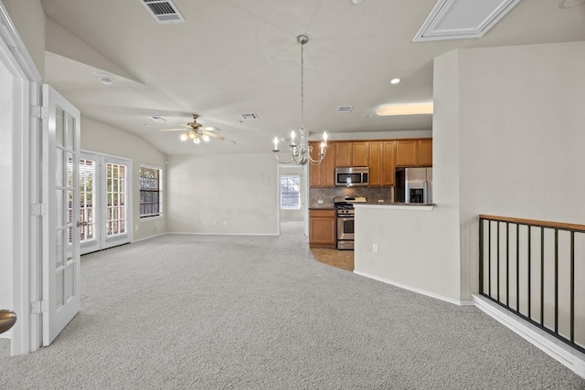 1310 Parmer Ln W Unit 3201, Austin, TX 78727 - kitchen with appliances with stainless steel finishes, brown cabinetry, light carpet, a ceiling fan, and decorative backsplash