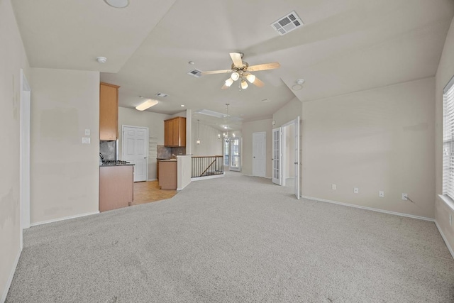1310 Parmer Ln W Unit 3201, Austin, TX 78727 - unfurnished living room featuring light carpet, ceiling fan, and a chandelier