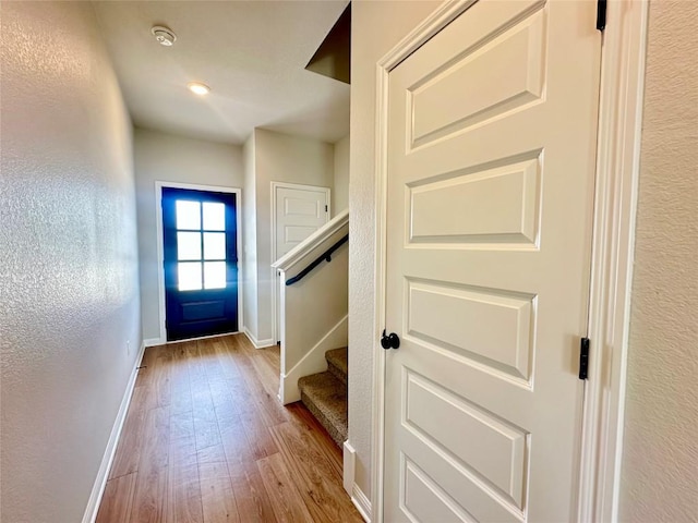 149 Gullivers Dr, Elgin, TX 78621 - doorway to outside featuring wood finished floors and stairs