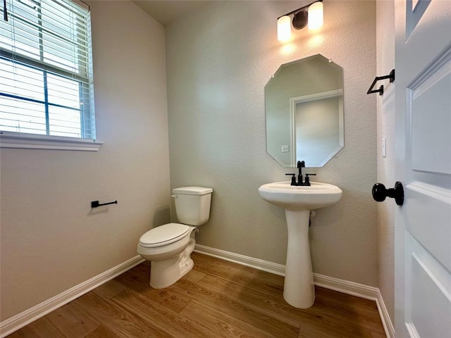149 Gullivers Dr, Elgin, TX 78621 - bathroom featuring wood finished floors and toilet