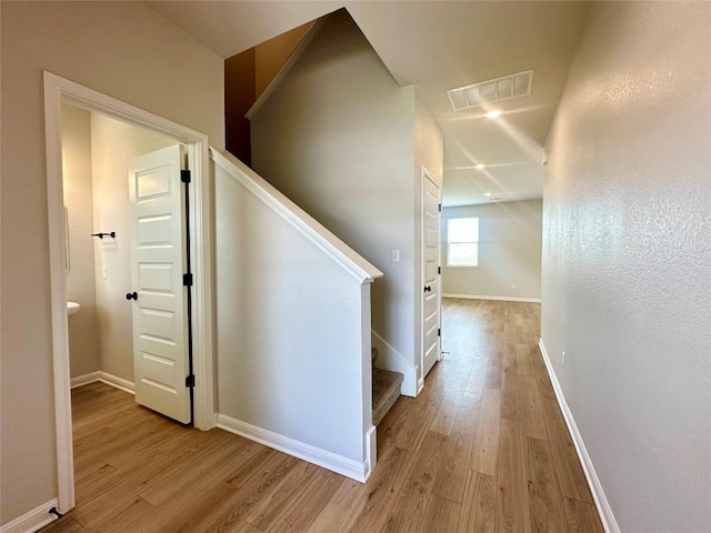 149 Gullivers Dr, Elgin, TX 78621 - stairs featuring wood finished floors and baseboards