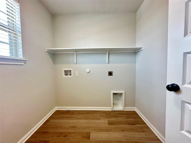 149 Gullivers Dr, Elgin, TX 78621 - laundry area with gas dryer hookup, hookup for an electric dryer, hookup for a washing machine, and wood finished floors