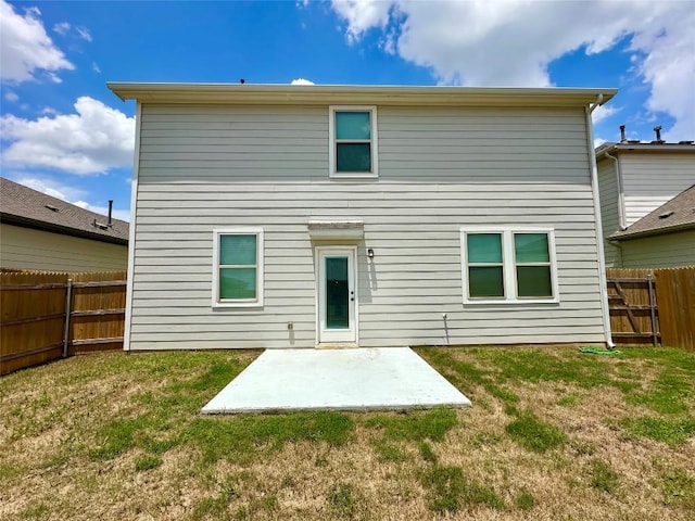 149 Gullivers Dr, Elgin, TX 78621 - back of property featuring a patio area and a fenced backyard
