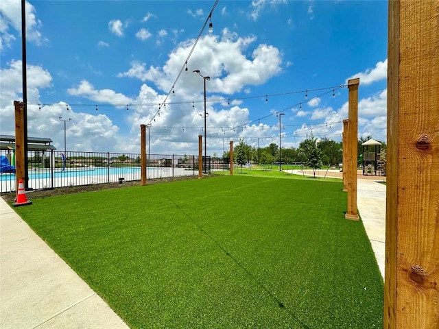 149 Gullivers Dr, Elgin, TX 78621 - view of yard featuring a community pool