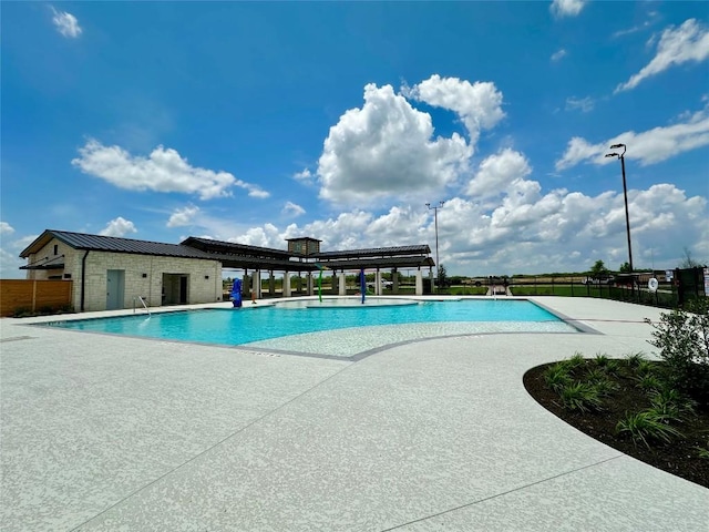 149 Gullivers Dr, Elgin, TX 78621 - community pool with a patio