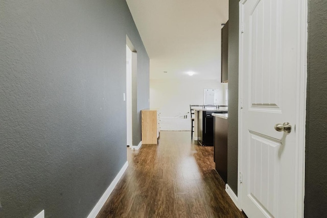 184 Voss St, Kyle, TX 78640 - hall with dark wood-style flooring and baseboards