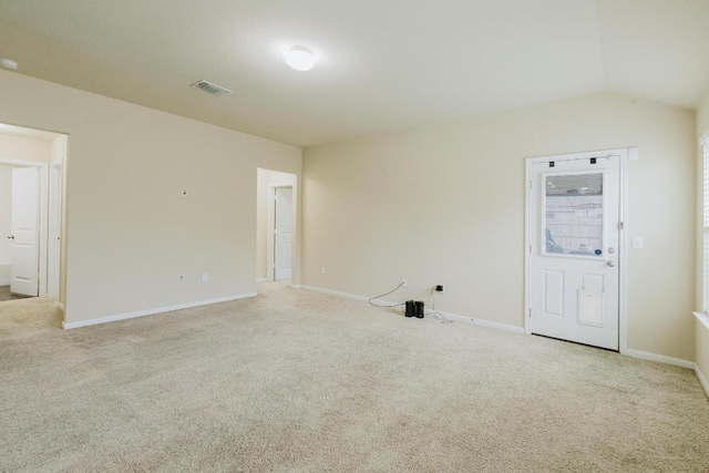 184 Voss St, Kyle, TX 78640 - carpeted empty room with baseboards and lofted ceiling