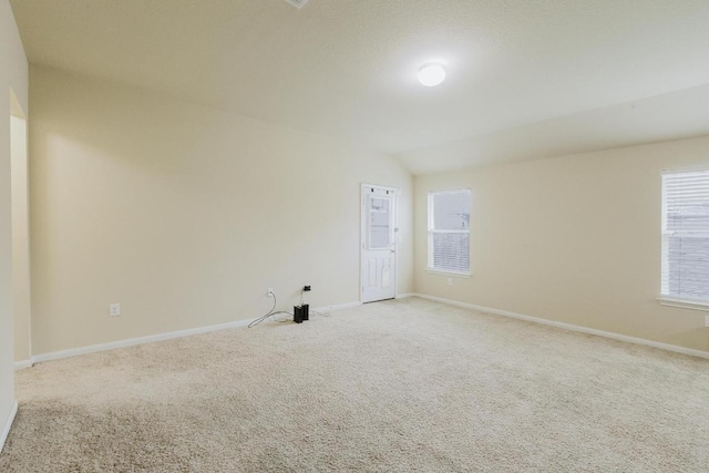 184 Voss St, Kyle, TX 78640 - carpeted spare room featuring baseboards and lofted ceiling