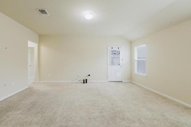 184 Voss St, Kyle, TX 78640 - unfurnished room with light colored carpet and lofted ceiling