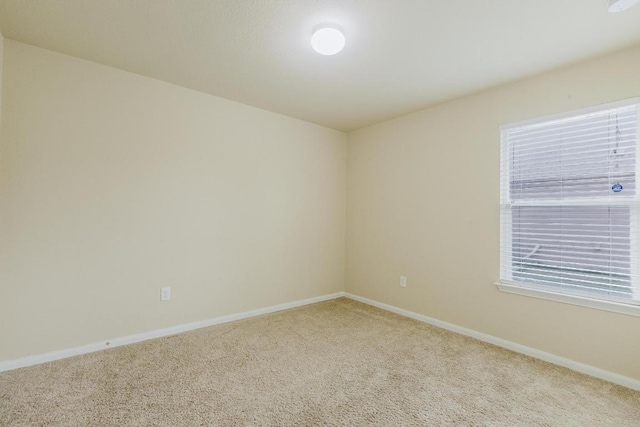 184 Voss St, Kyle, TX 78640 - carpeted spare room featuring baseboards