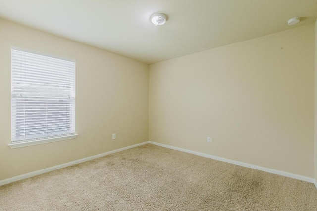 184 Voss St, Kyle, TX 78640 - carpeted spare room featuring a smoke detector and baseboards