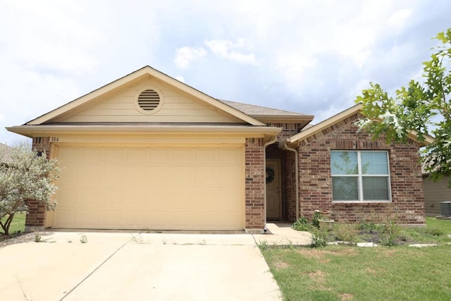 184 Voss St, Kyle, TX 78640 - single story home featuring concrete driveway, a garage, and brick siding