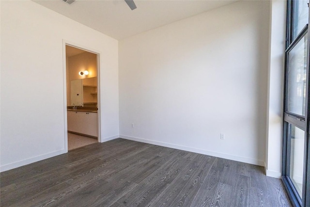 800 Embassy Dr Unit 137, Austin, TX 78702 - spare room with dark wood-type flooring and ceiling fan