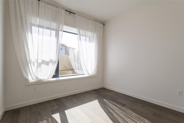 800 Embassy Dr Unit 137, Austin, TX 78702 - empty room with dark wood finished floors and baseboards
