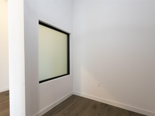 800 Embassy Dr Unit 137, Austin, TX 78702 - spare room featuring dark wood-type flooring and baseboards