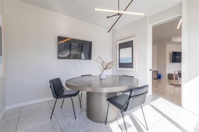 800 Embassy Dr Unit 137, Austin, TX 78702 - dining space with a chandelier and light tile patterned flooring