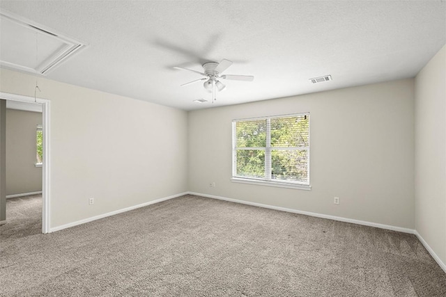 3416 Oxsheer Dr, Austin, TX 78732 - unfurnished room with attic access, carpet, and a ceiling fan