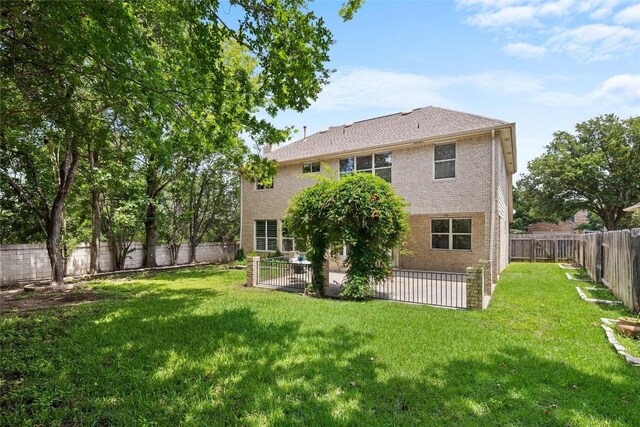 3416 Oxsheer Dr, Austin, TX 78732 - rear view of house with a fenced backyard, a patio, and brick siding
