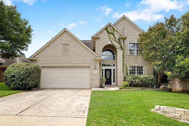 3416 Oxsheer Dr, Austin, TX 78732 - view of front facade featuring brick siding, driveway, and an attached garage