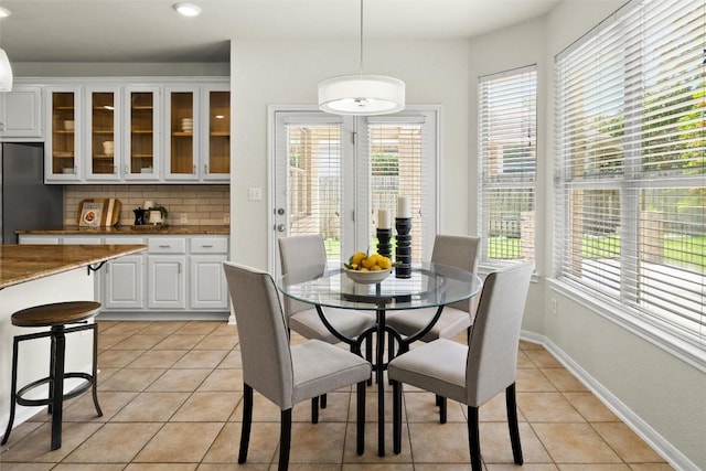3416 Oxsheer Dr, Austin, TX 78732 - dining area with healthy amount of natural light, light tile patterned flooring, and recessed lighting