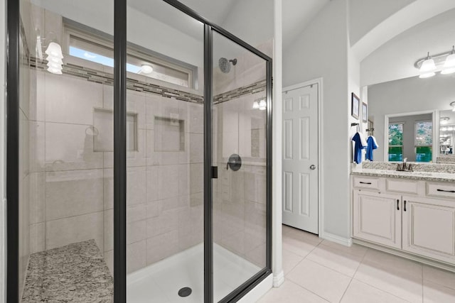 232 Mandana St, Leander, TX 78641 - full bath with vanity, a shower stall, and tile patterned flooring