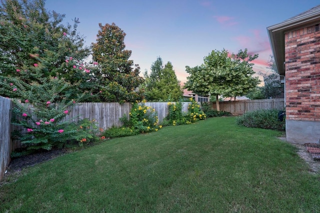232 Mandana St, Leander, TX 78641 - yard at dusk featuring a fenced backyard